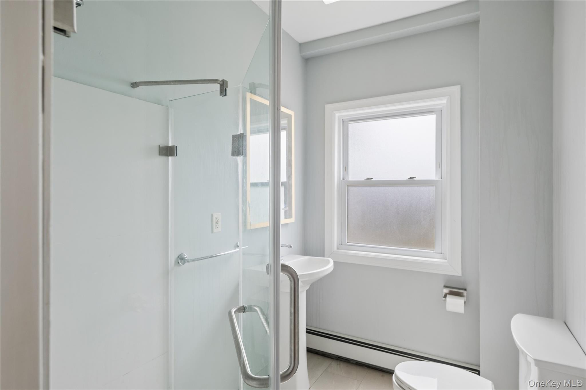 40 Scholar Lane Commack, NY 11725 - Photo 32 of 49 a bathroom with a granite countertop shower and a toilet