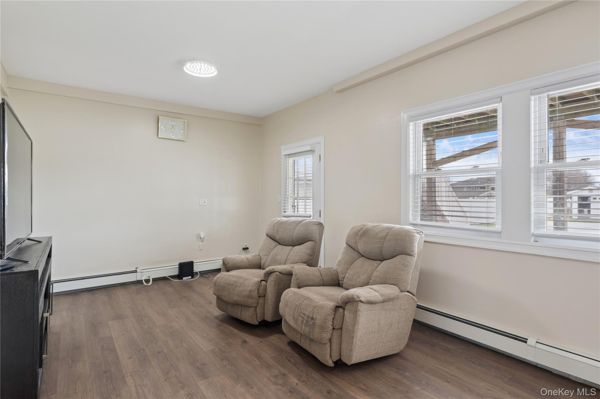 40 Scholar Lane Commack, NY 11725 - Photo 33 of 49 a living room with furniture and a window