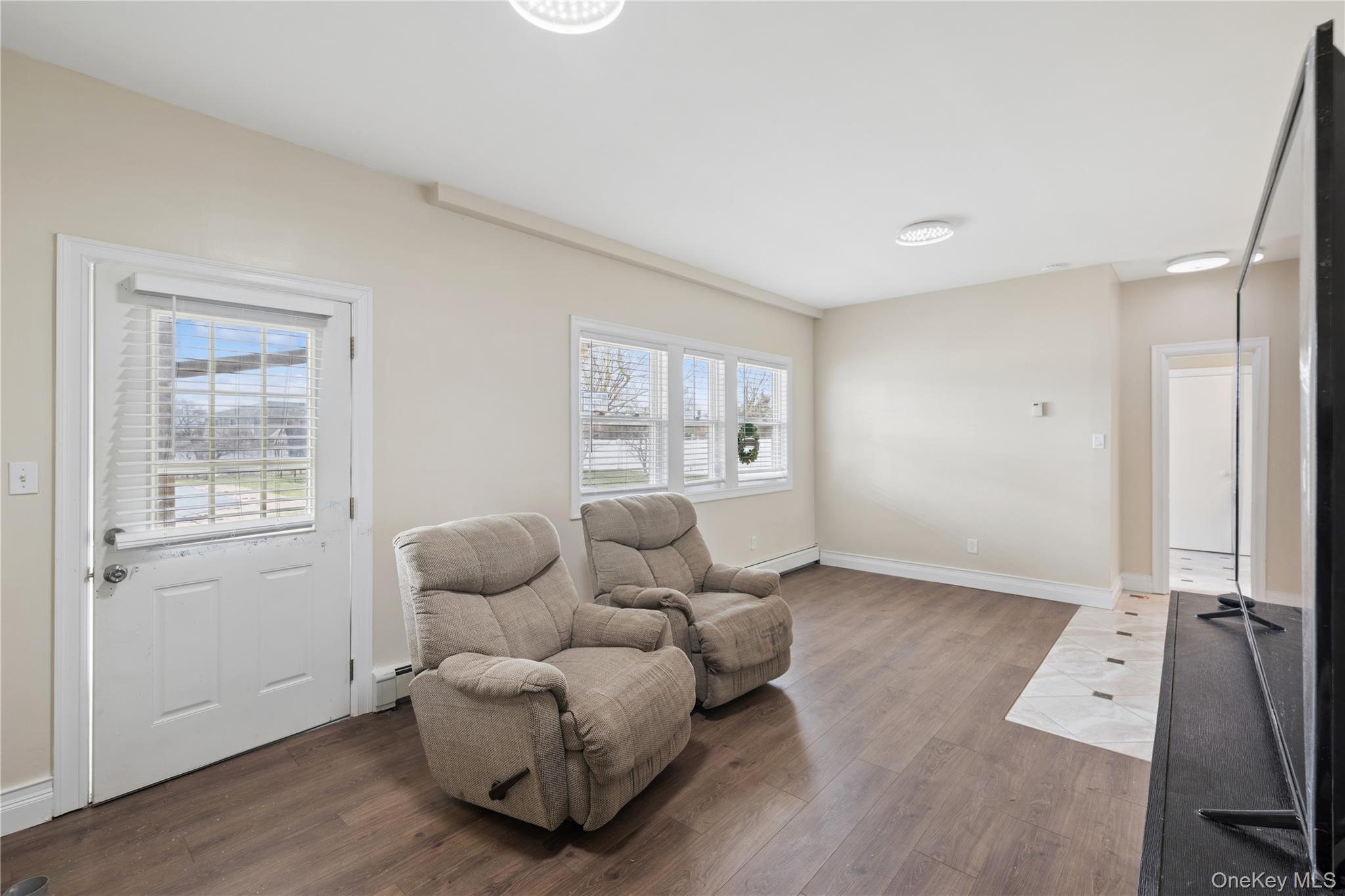 40 Scholar Lane Commack, NY 11725 - Photo 34 of 49 a living room with furniture chess board and a window