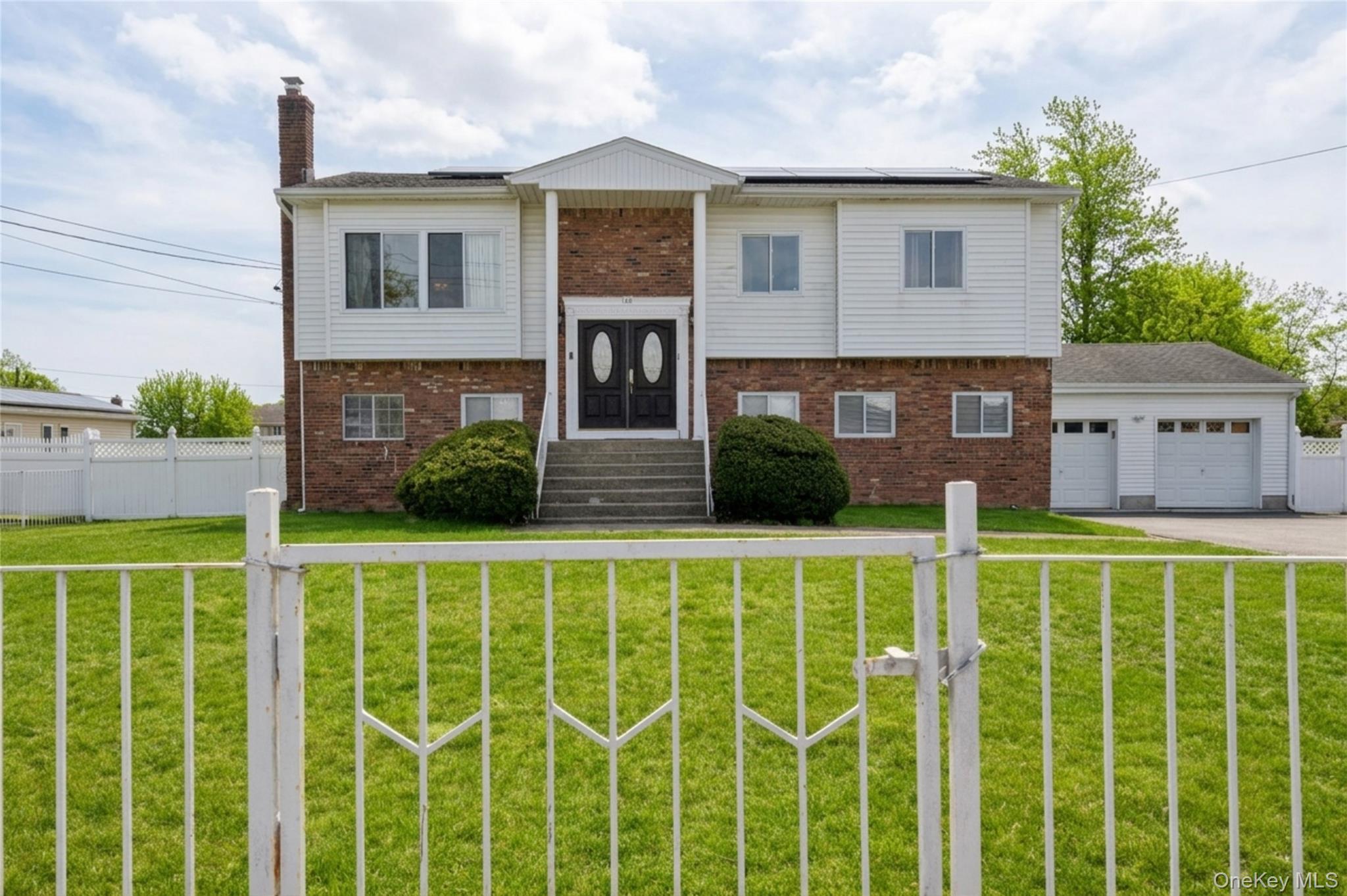40 Scholar Lane Commack, NY 11725 - Photo 4 of 49 a view of a house with a wooden deck
