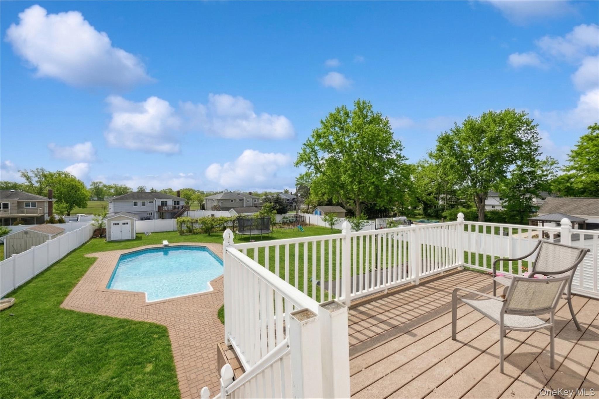 40 Scholar Lane Commack, NY 11725 - Photo 44 of 49 a view of a roof deck with couches