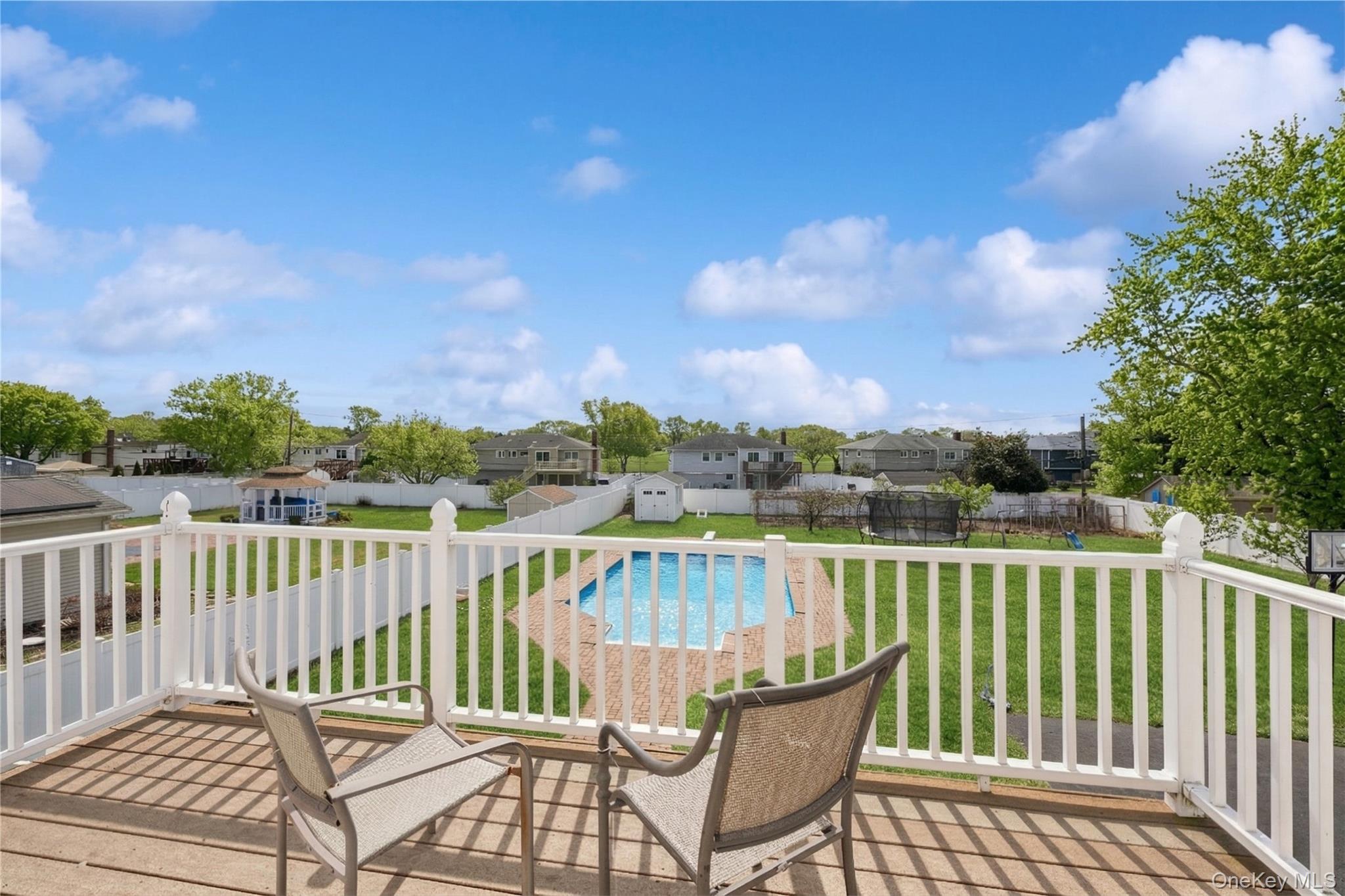 40 Scholar Lane Commack, NY 11725 - Photo 45 of 49 a view of a chair and table on the roof deck