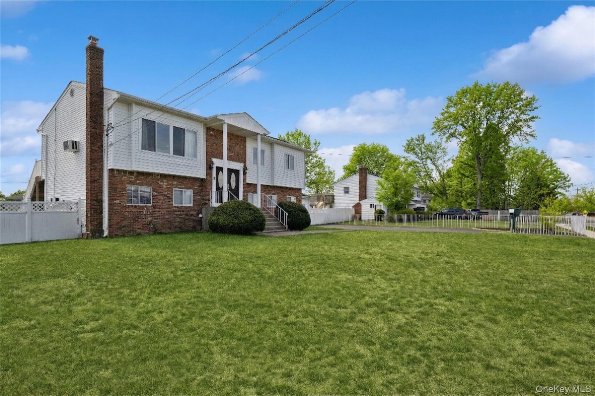 40 Scholar Lane Commack, NY 11725 - Photo 46 of 49 a view of a house with a back yard