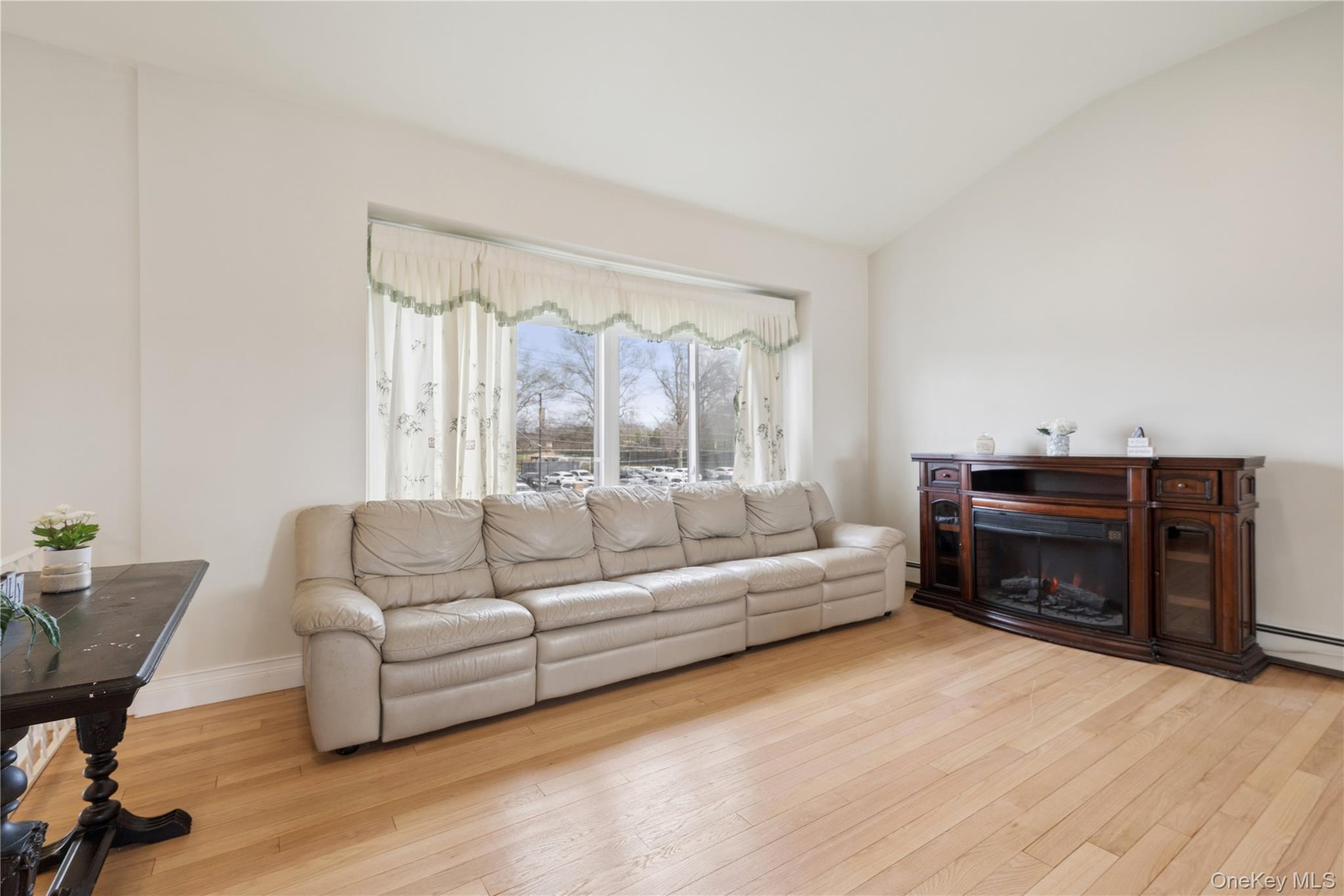 40 Scholar Lane Commack, NY 11725 - Photo 6 of 49 a living room with furniture and a fireplace