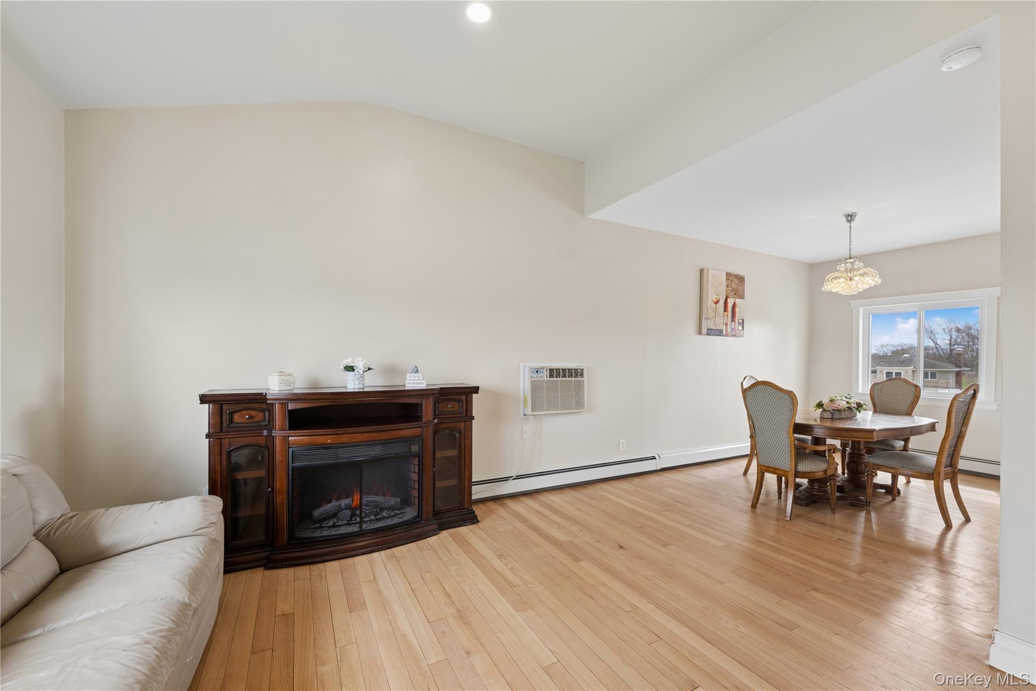 40 Scholar Lane Commack, NY 11725 - Photo 7 of 49 a living room with furniture and a fireplace
