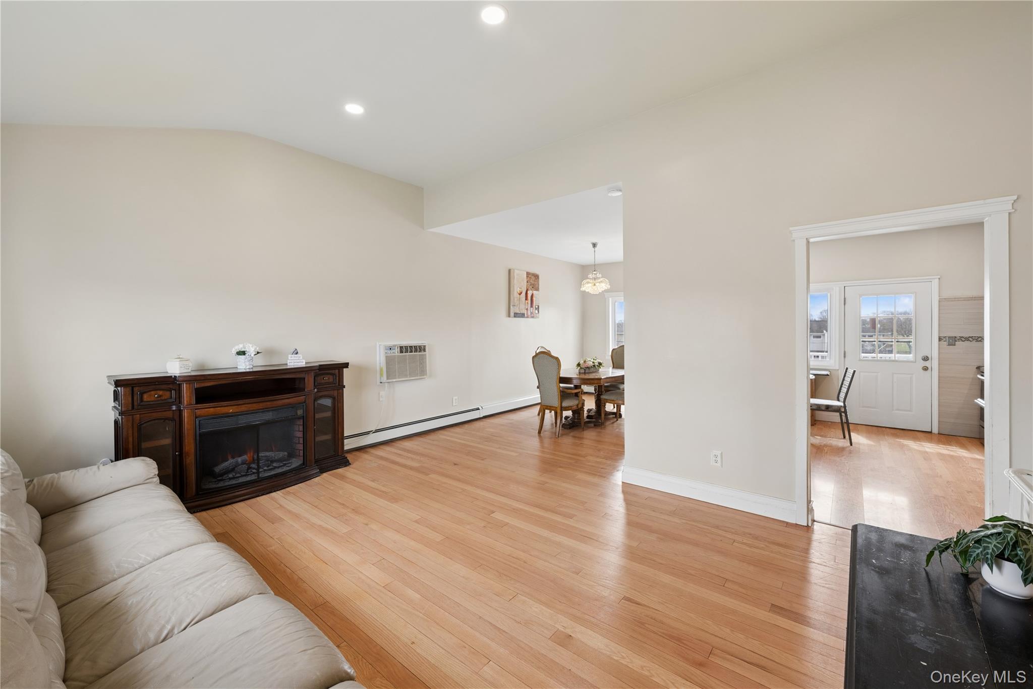 40 Scholar Lane Commack, NY 11725 - Photo 8 of 49 a living room with furniture and wooden floor