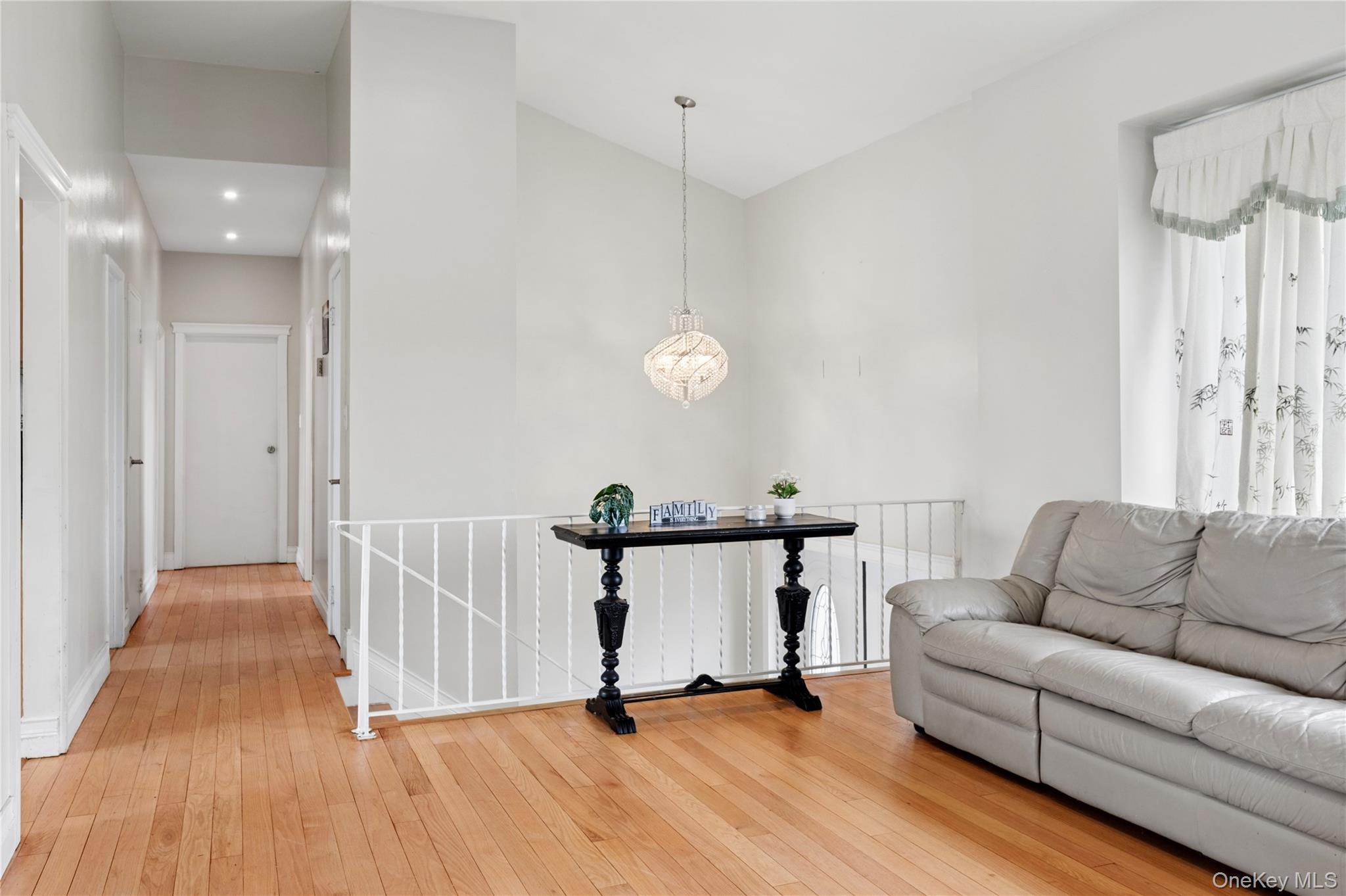 40 Scholar Lane Commack, NY 11725 - Photo 9 of 49 a living room with furniture and a wooden floor
