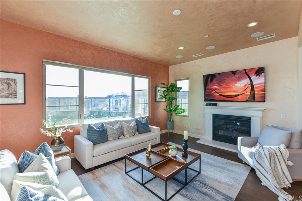 323 Via Pamplona San Clemente, CA 92672 - Photo 12 of 74 a living room with furniture a fireplace and a flat screen tv
