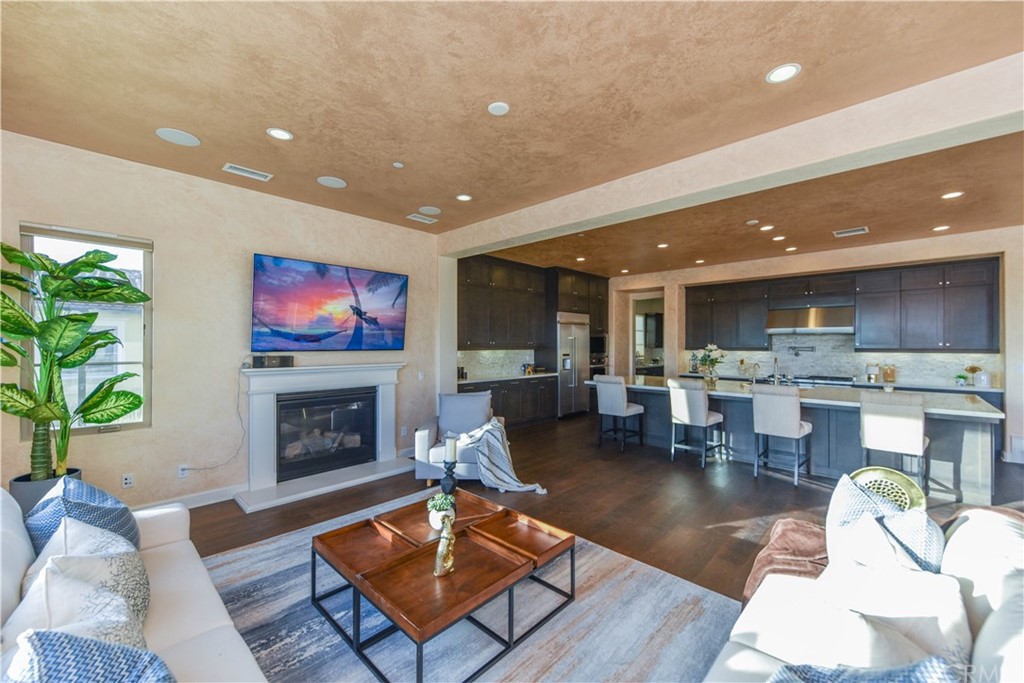323 Via Pamplona San Clemente, CA 92672 - Photo 13 of 74 a living room with fireplace furniture and a flat screen tv