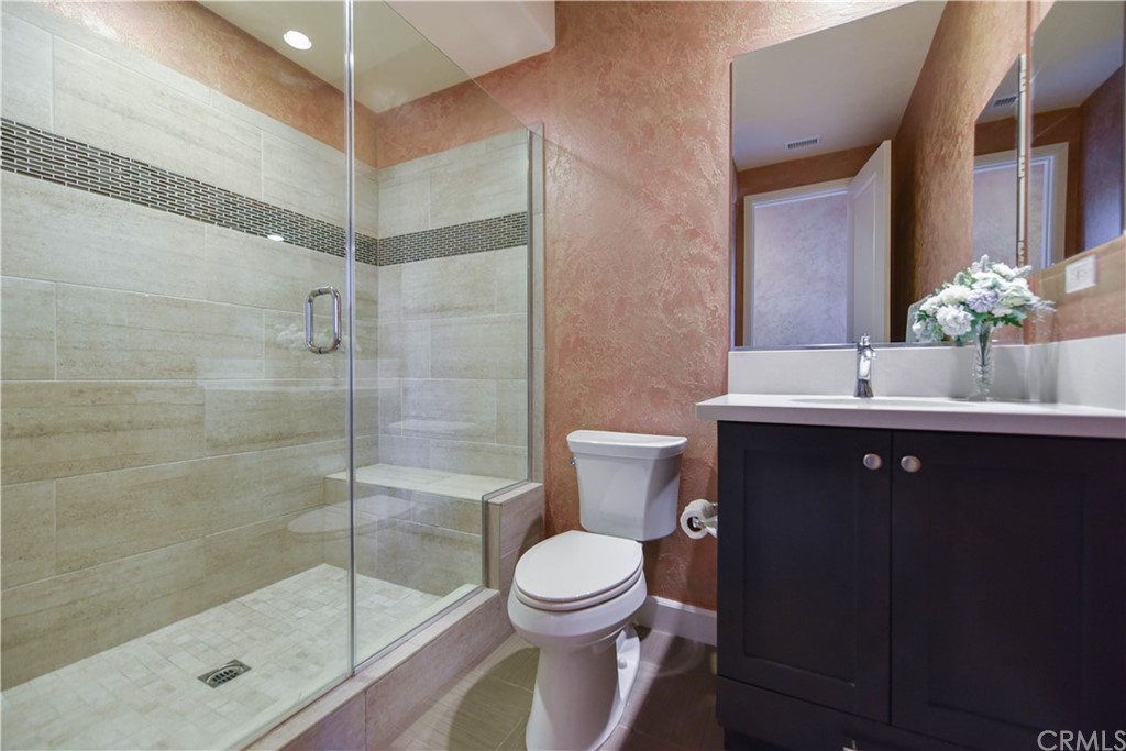 323 Via Pamplona San Clemente, CA 92672 - Photo 22 of 74 a bathroom with a sink toilet a mirror and shower