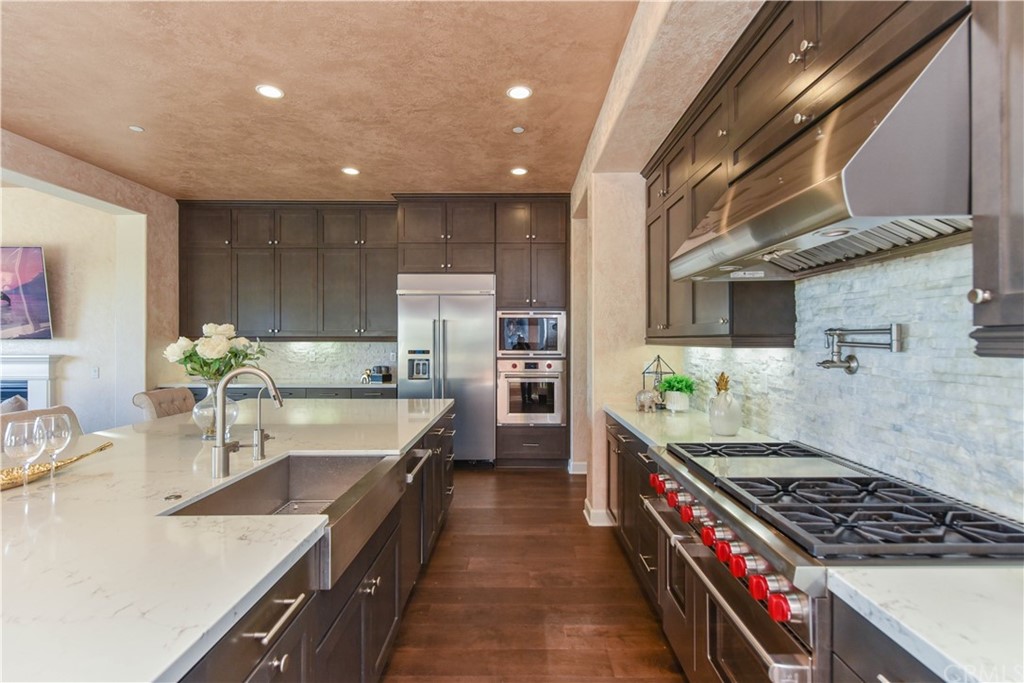 323 Via Pamplona San Clemente, CA 92672 - Photo 3 of 74 a kitchen with stainless steel appliances granite countertop a sink stove and refrigerator