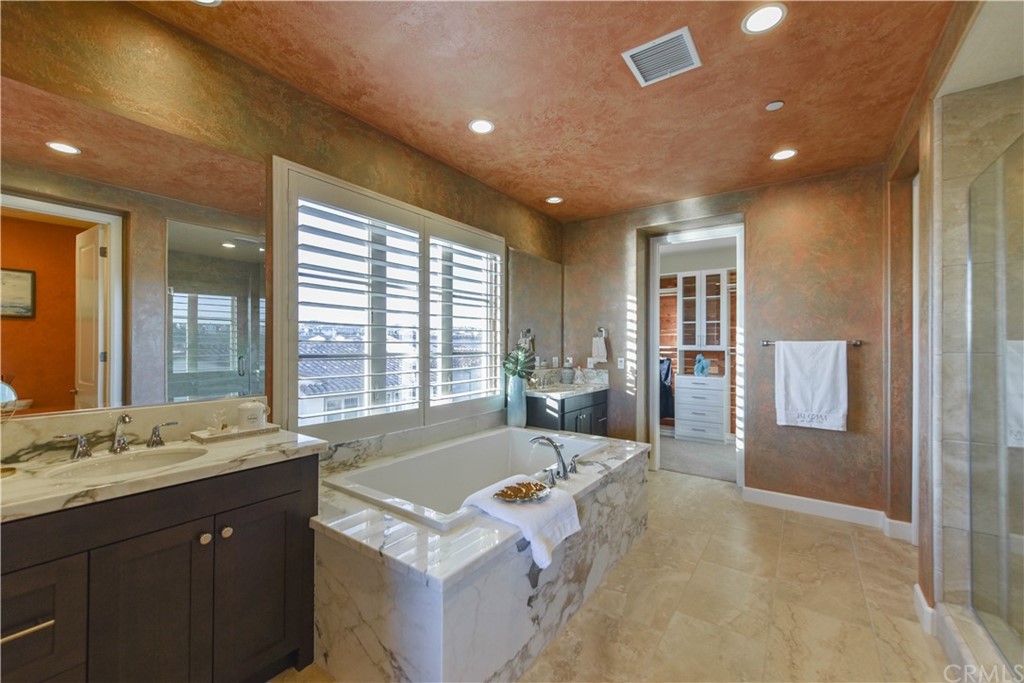 323 Via Pamplona San Clemente, CA 92672 - Photo 31 of 74 a spacious bathroom with a tub sink and mirror