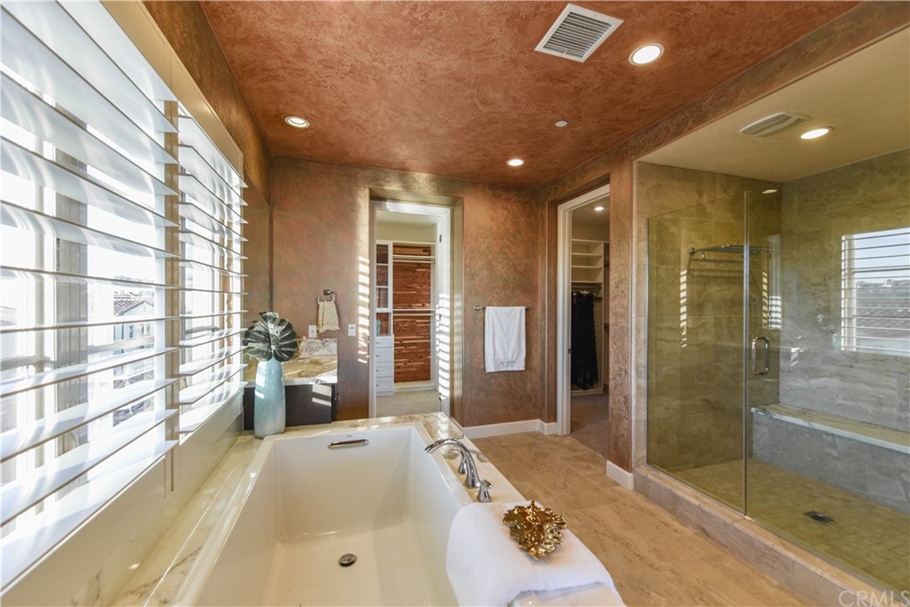 323 Via Pamplona San Clemente, CA 92672 - Photo 32 of 74 a spacious bathroom with a granite countertop tub shower and mirror