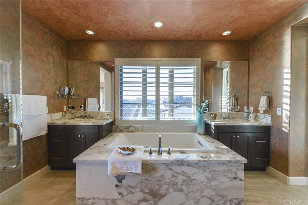 323 Via Pamplona San Clemente, CA 92672 - Photo 33 of 74 a bathroom with a granite countertop tub sink and mirror
