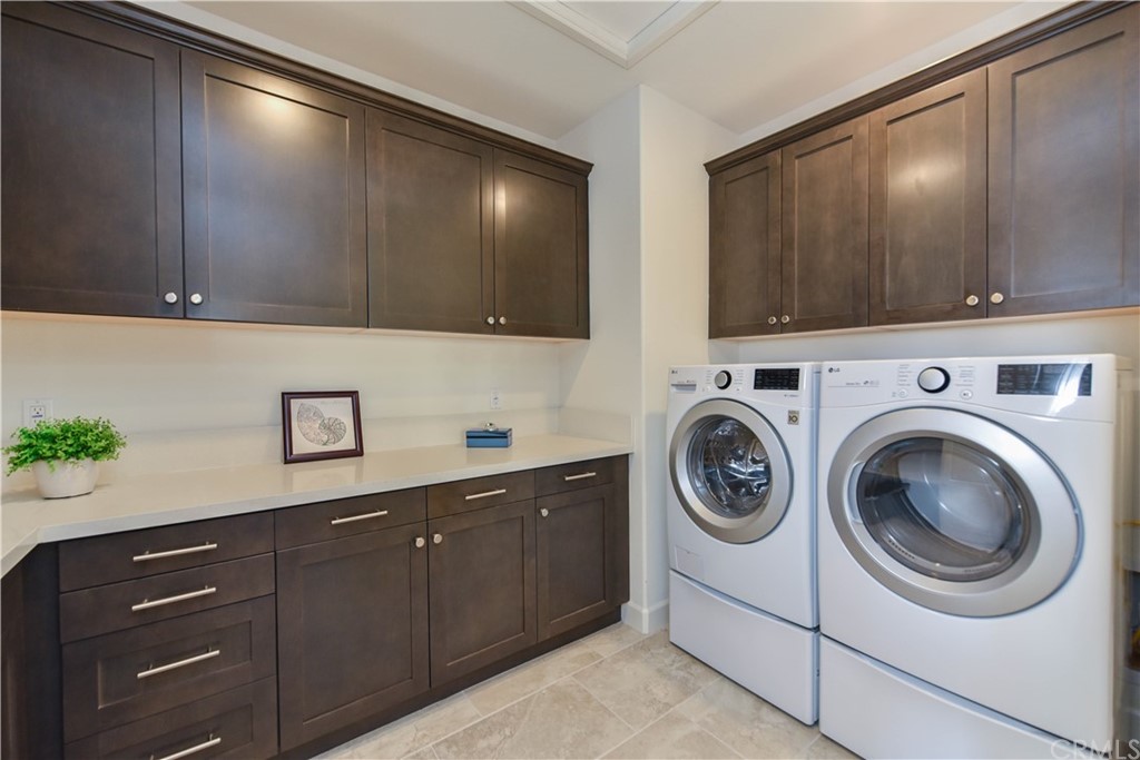 323 Via Pamplona San Clemente, CA 92672 - Photo 44 of 74 a utility room with sink dryer and washer