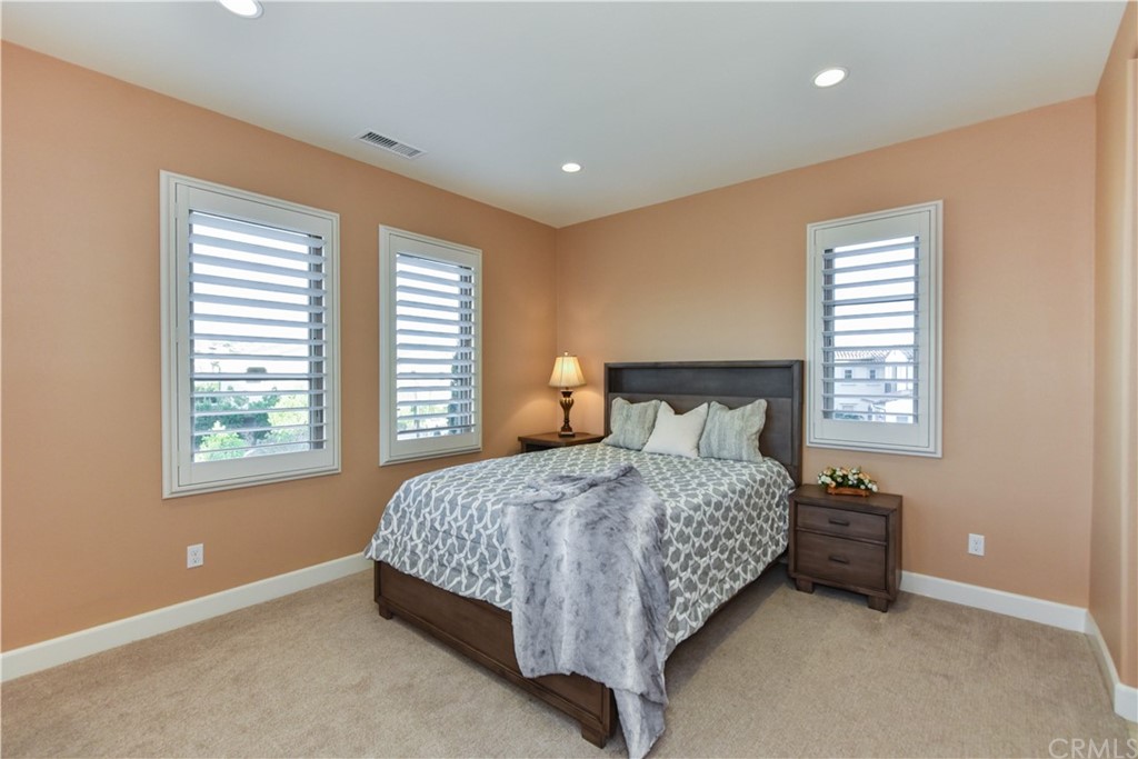323 Via Pamplona San Clemente, CA 92672 - Photo 46 of 74 a bedroom with a bed and a window