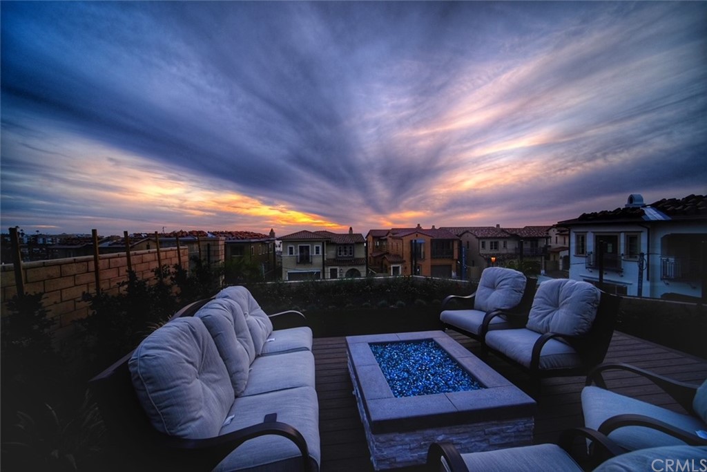 323 Via Pamplona San Clemente, CA 92672 - Photo 57 of 74 a roof deck with couches and potted plants with sky view
