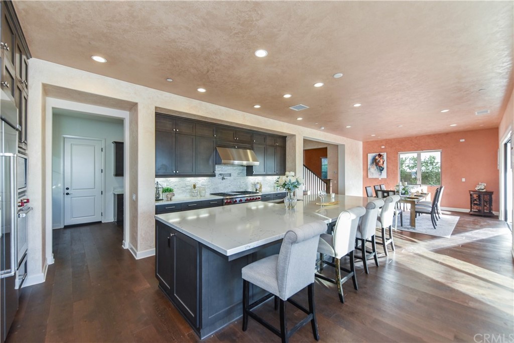 323 Via Pamplona San Clemente, CA 92672 - Photo 6 of 74 a large kitchen with a table and chairs