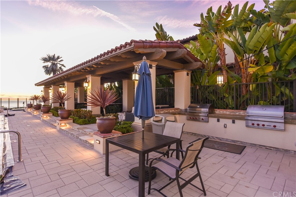 323 Via Pamplona San Clemente, CA 92672 - Photo 65 of 74 a view of a patio with table and chairs and a barbeque