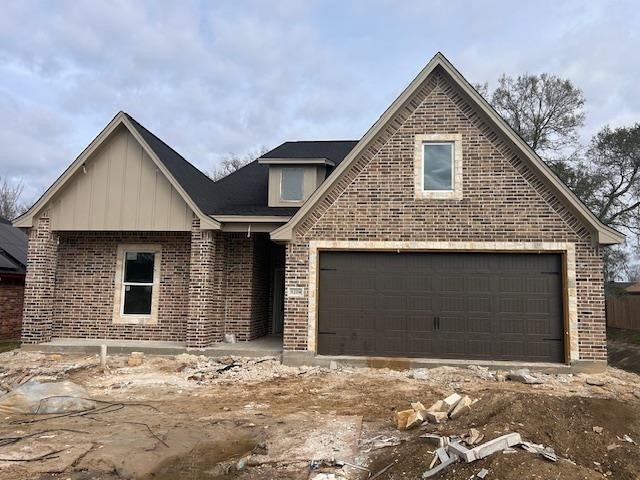9204 Riggs Street Beaumont, TX 77707 - Photo 1 of 20 a front view of a house with a yard and garage