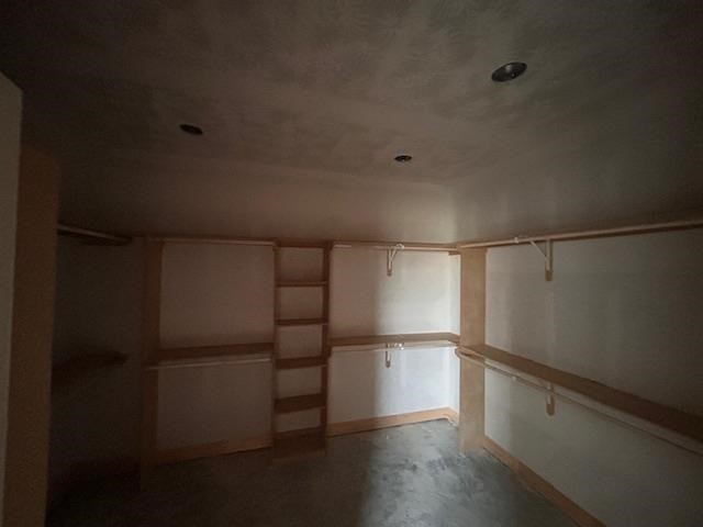 9204 Riggs Street Beaumont, TX 77707 - Photo 15 of 20 a walk in closet with wooden floor
