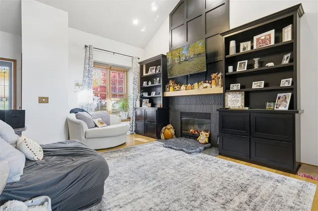 a view of staircase with furniture and rug