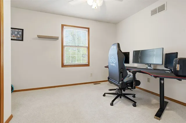 a bathroom with a toilet a sink and a mirror