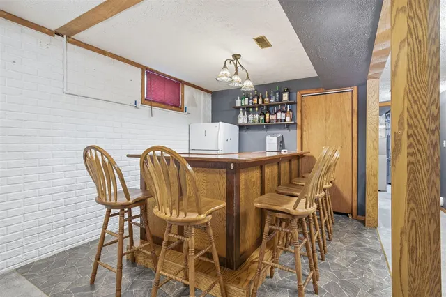 a livingroom with chairs and table in a room