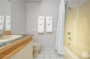 223 Hunter Road, Unit B303 Brian Head, UT 84719 - Photo 27 of 49 Full bath featuring vanity, shower / bath combination with curtain, and light tile patterned floors
