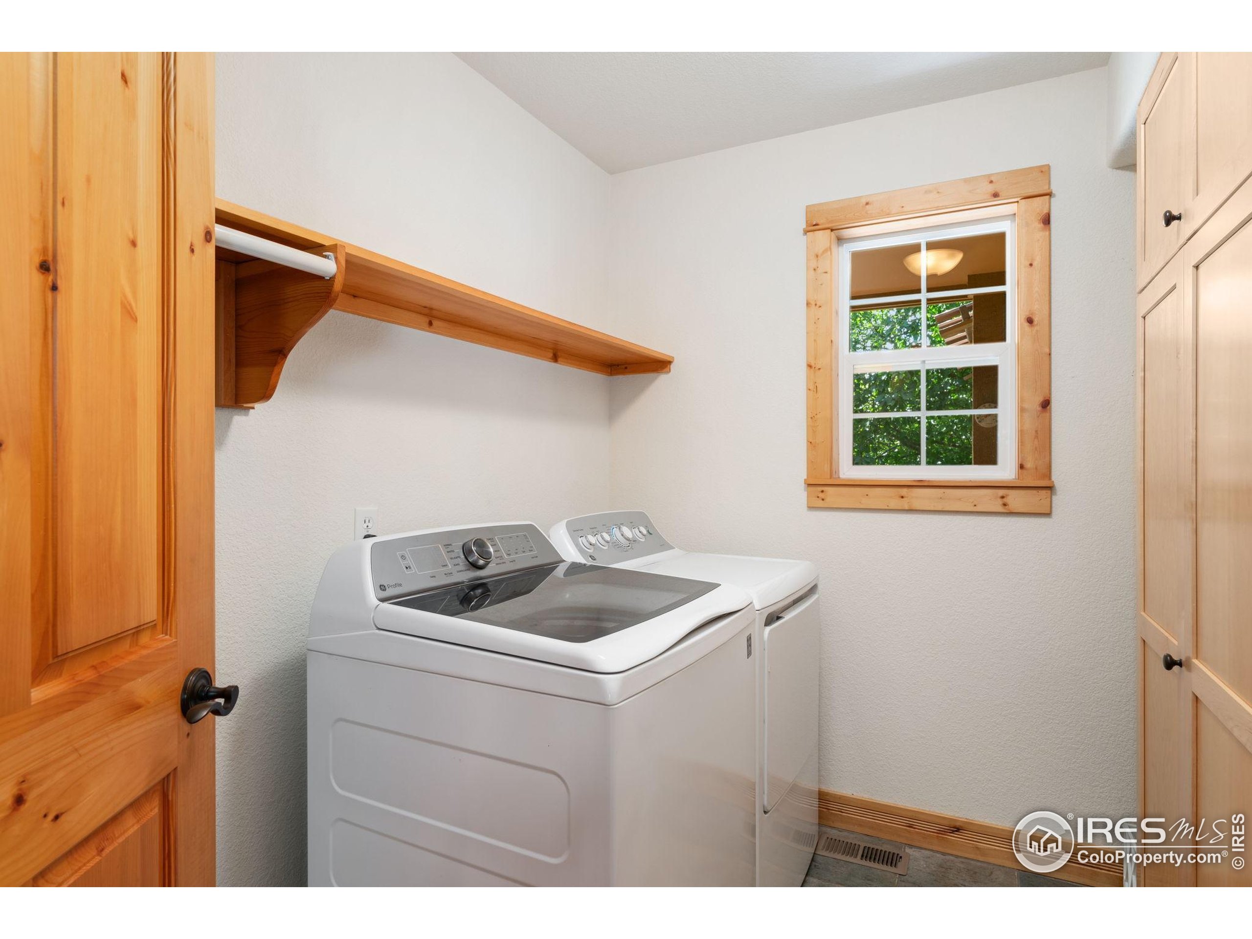 3302 Rinn Valley Drive Longmont, CO 80504 - Photo 12 of 45 a utility room with dryer and washer