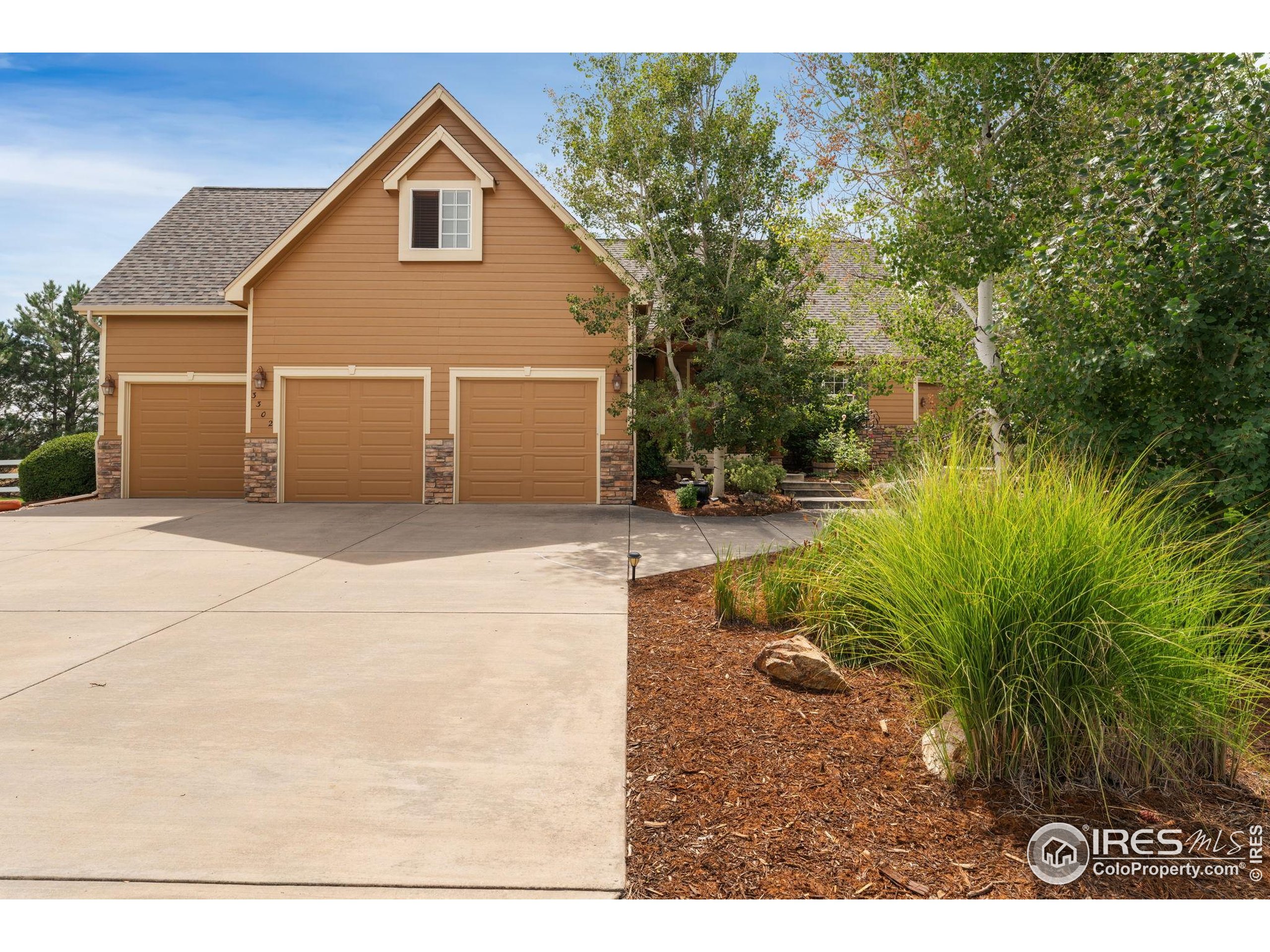 3302 Rinn Valley Drive Longmont, CO 80504 - Photo 2 of 45 a view of a house with a yard