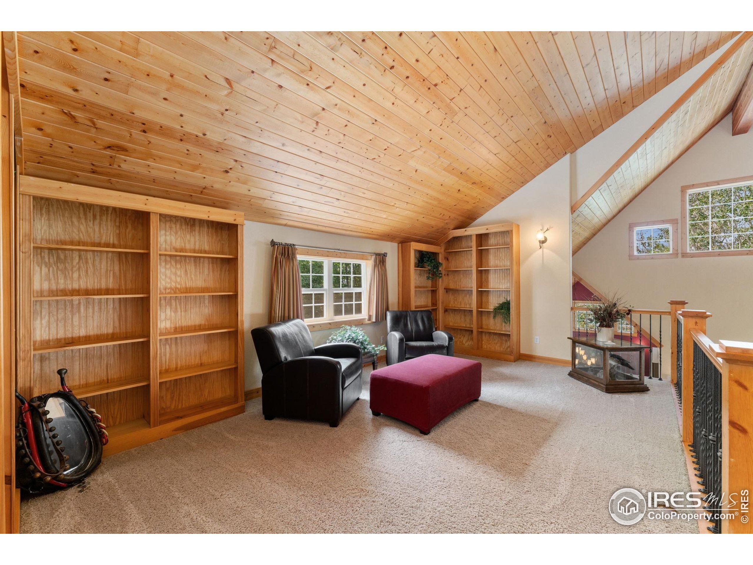 3302 Rinn Valley Drive Longmont, CO 80504 - Photo 22 of 45 a living room with furniture a flat screen tv and large window