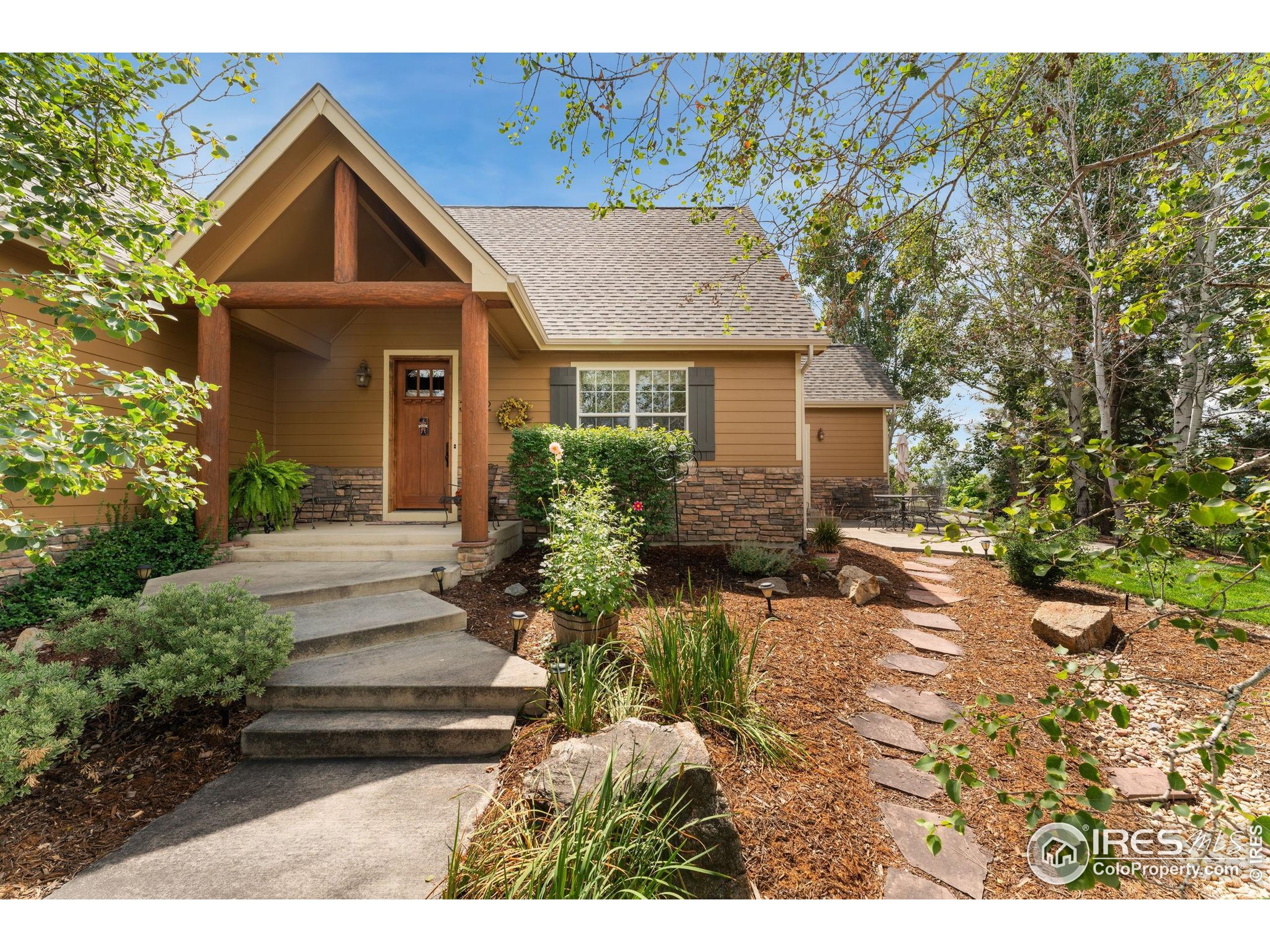3302 Rinn Valley Drive Longmont, CO 80504 - Photo 3 of 45 a front view of house with yard and trees around
