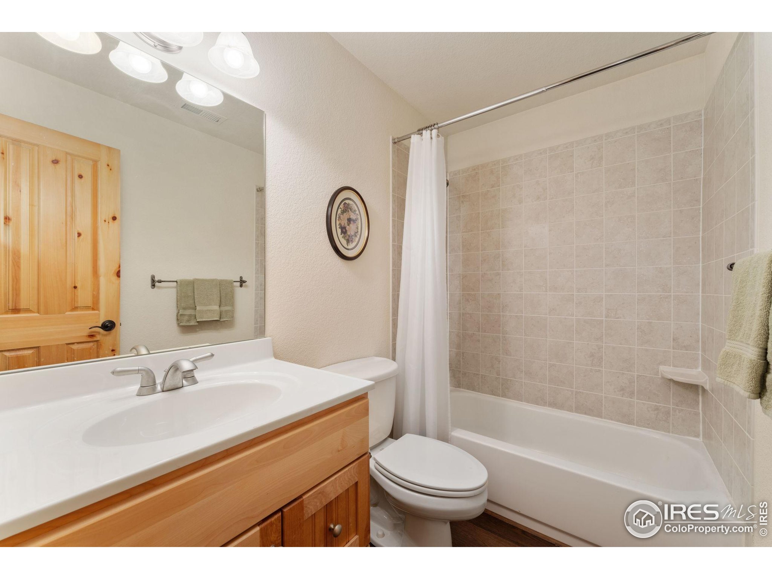 3302 Rinn Valley Drive Longmont, CO 80504 - Photo 31 of 45 a bathroom with a sink a toilet and a bathtub