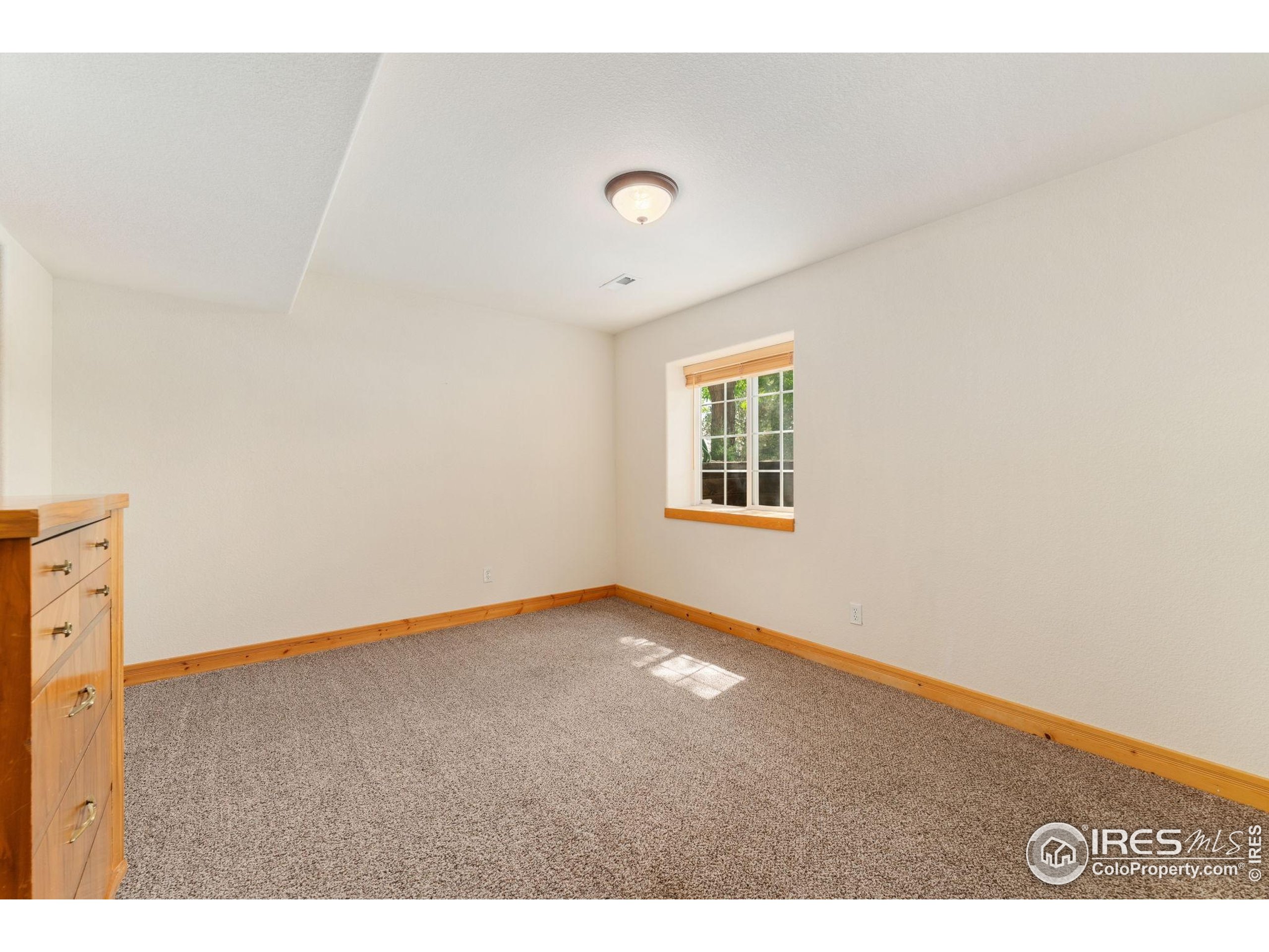 3302 Rinn Valley Drive Longmont, CO 80504 - Photo 32 of 45 a view of an empty room with a window