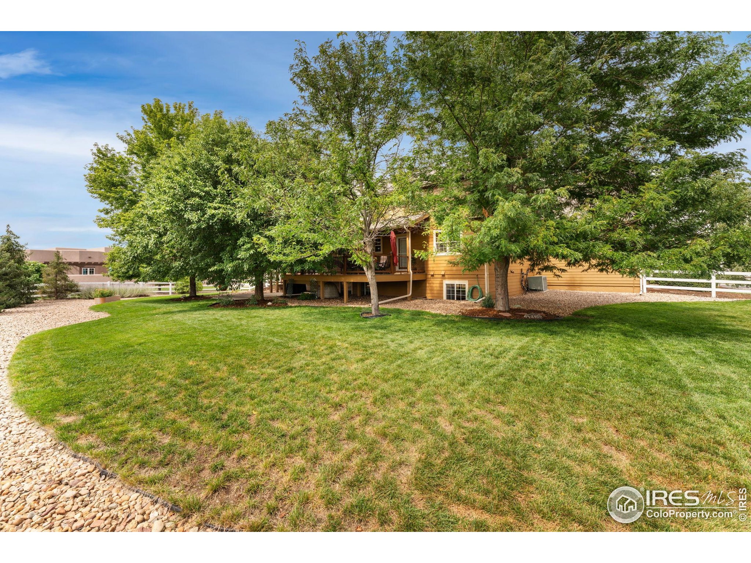 3302 Rinn Valley Drive Longmont, CO 80504 - Photo 33 of 45 a view of a house with a big yard