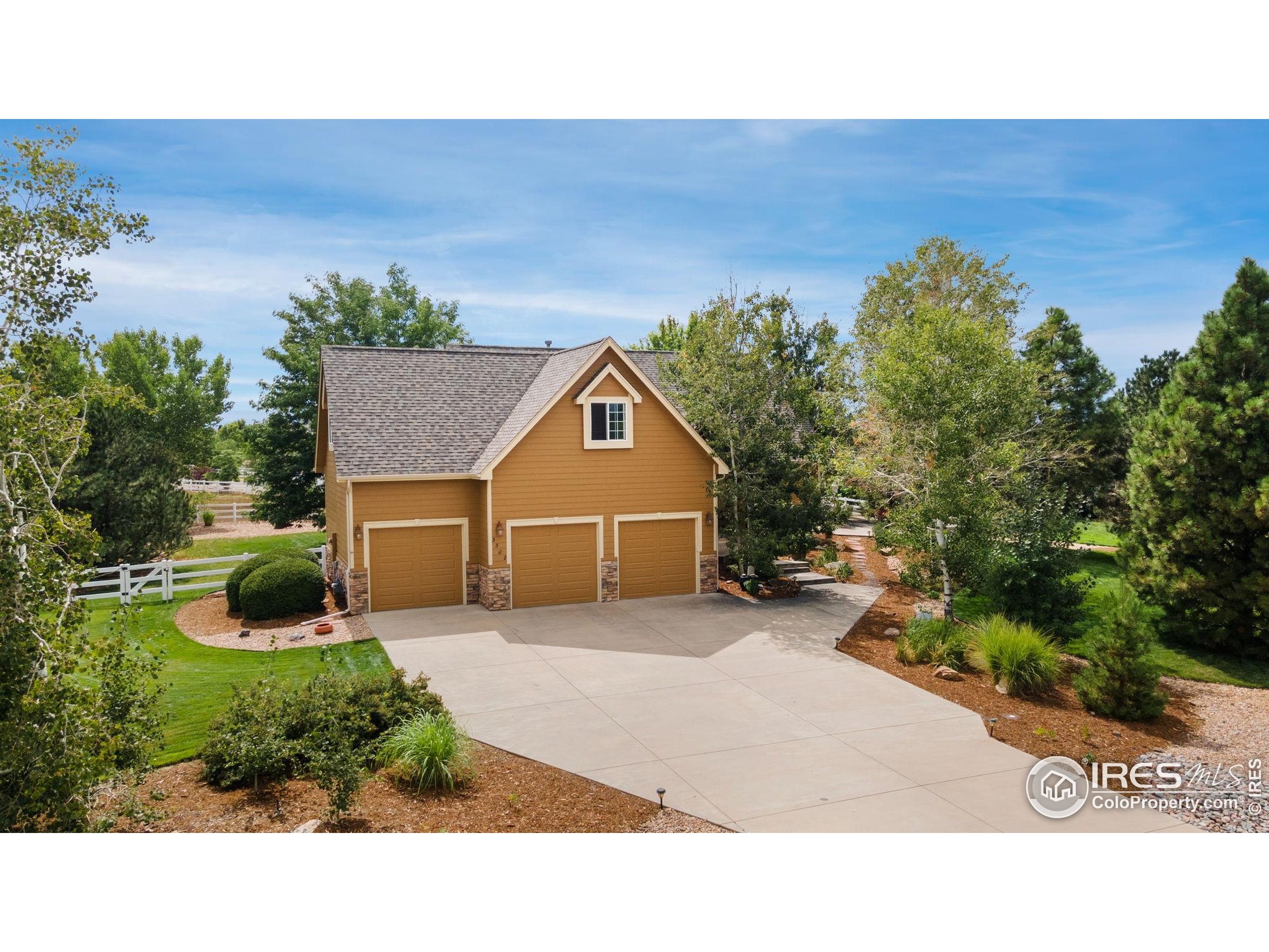 3302 Rinn Valley Drive Longmont, CO 80504 - Photo 36 of 45 a house view with a garden space