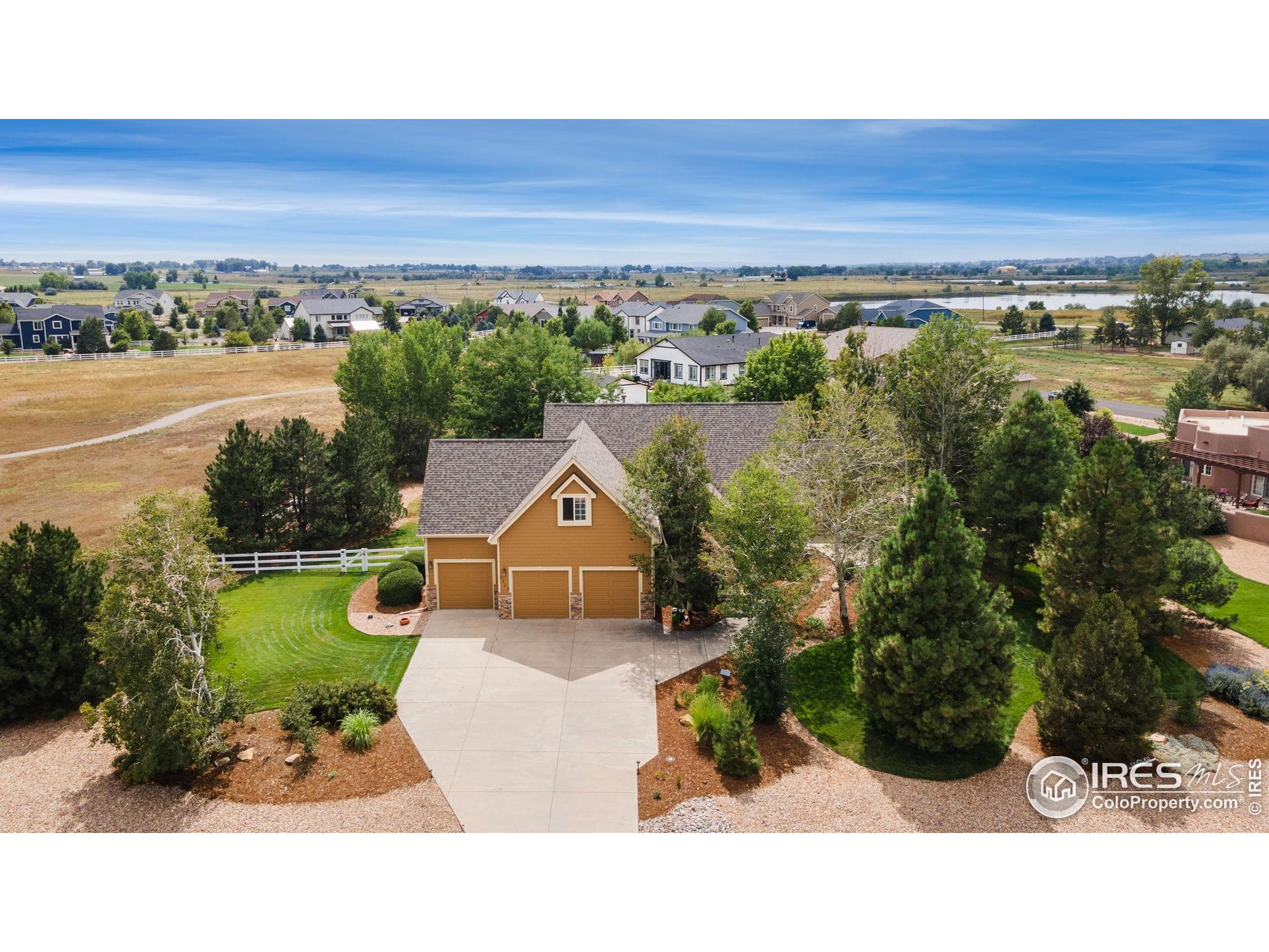 3302 Rinn Valley Drive Longmont, CO 80504 - Photo 37 of 45 an aerial view of a house with a yard