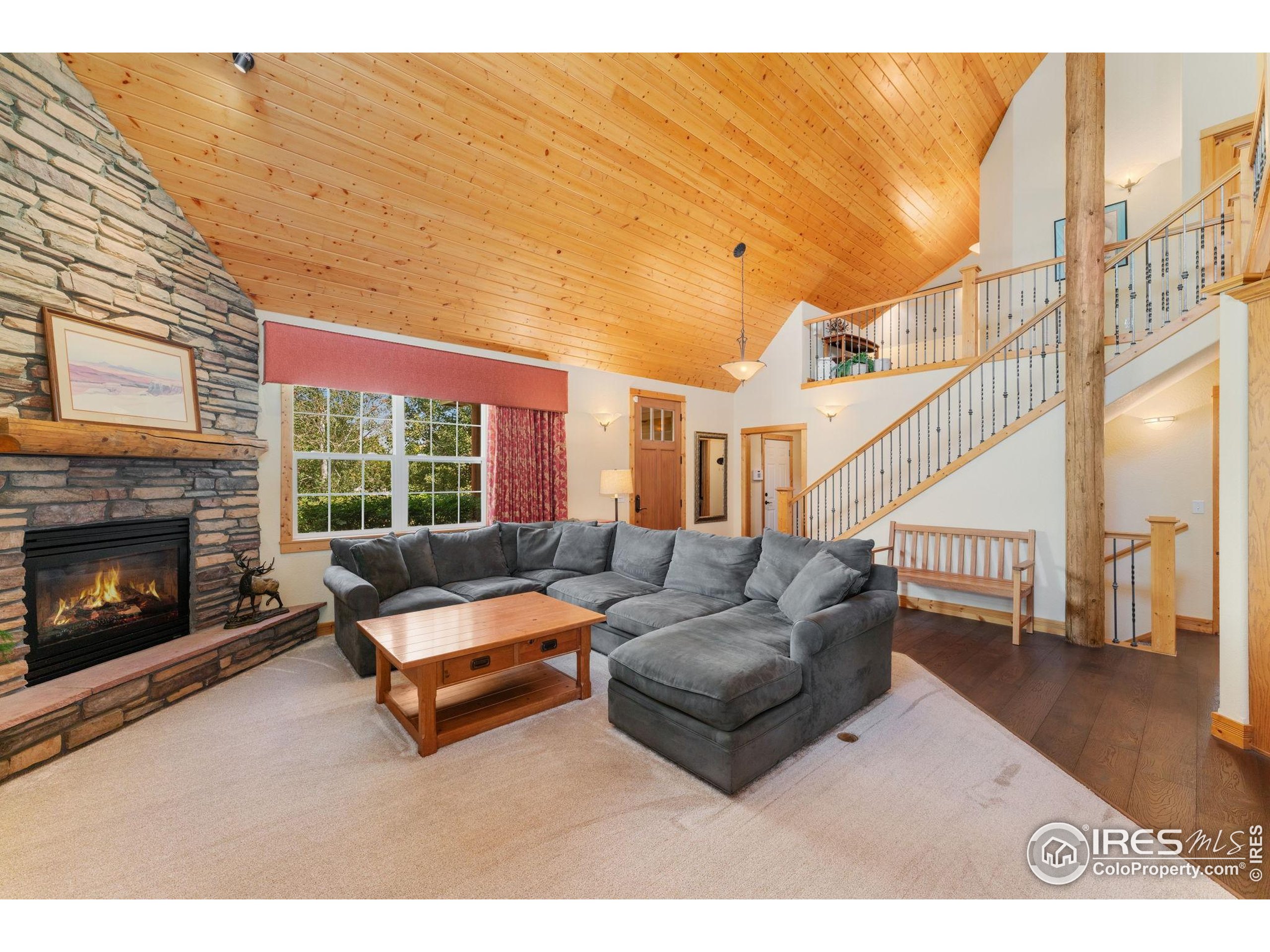 3302 Rinn Valley Drive Longmont, CO 80504 - Photo 6 of 45 a living room with furniture and a fireplace