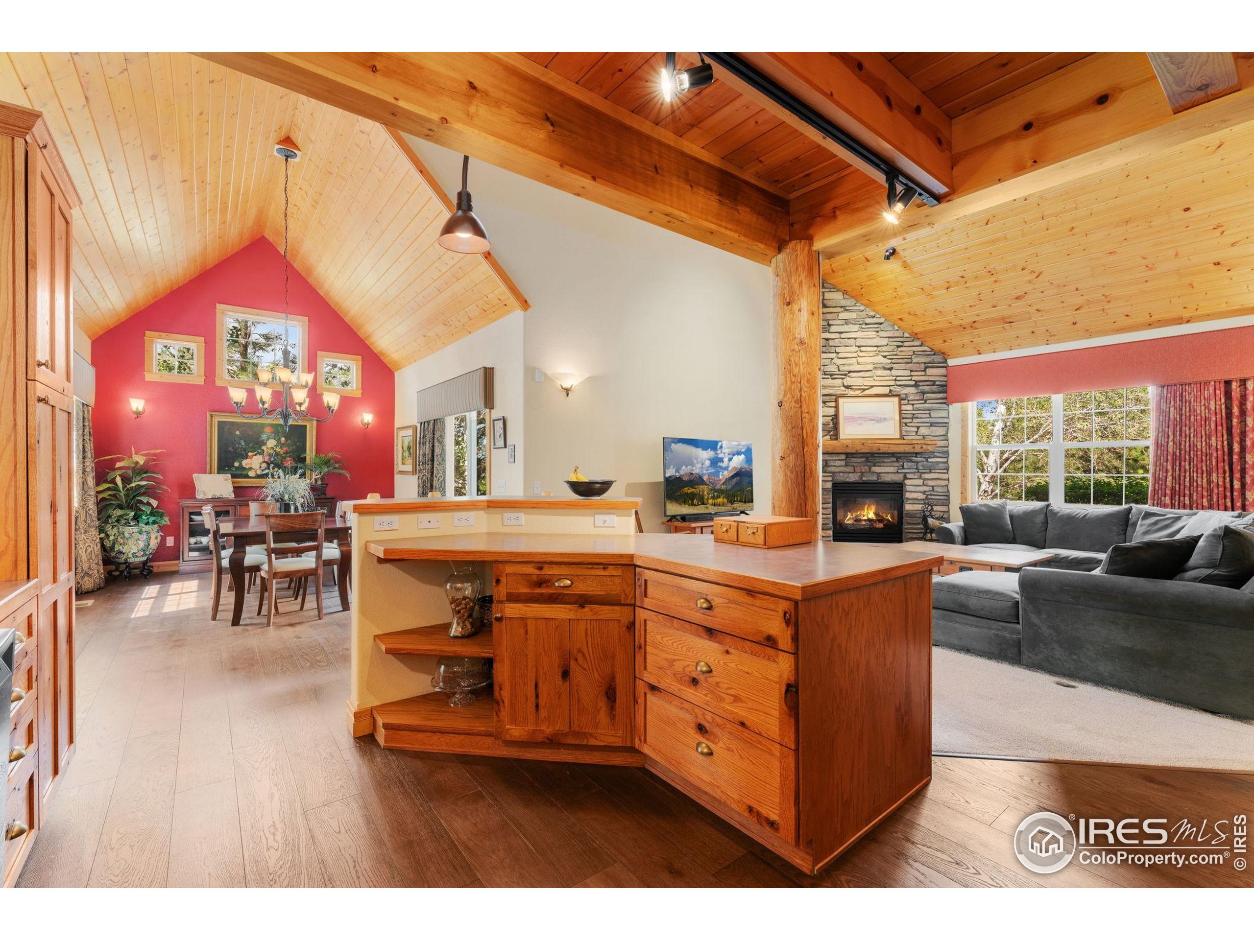 3302 Rinn Valley Drive Longmont, CO 80504 - Photo 9 of 45 a living room with stainless steel appliances kitchen island granite countertop furniture and a large window