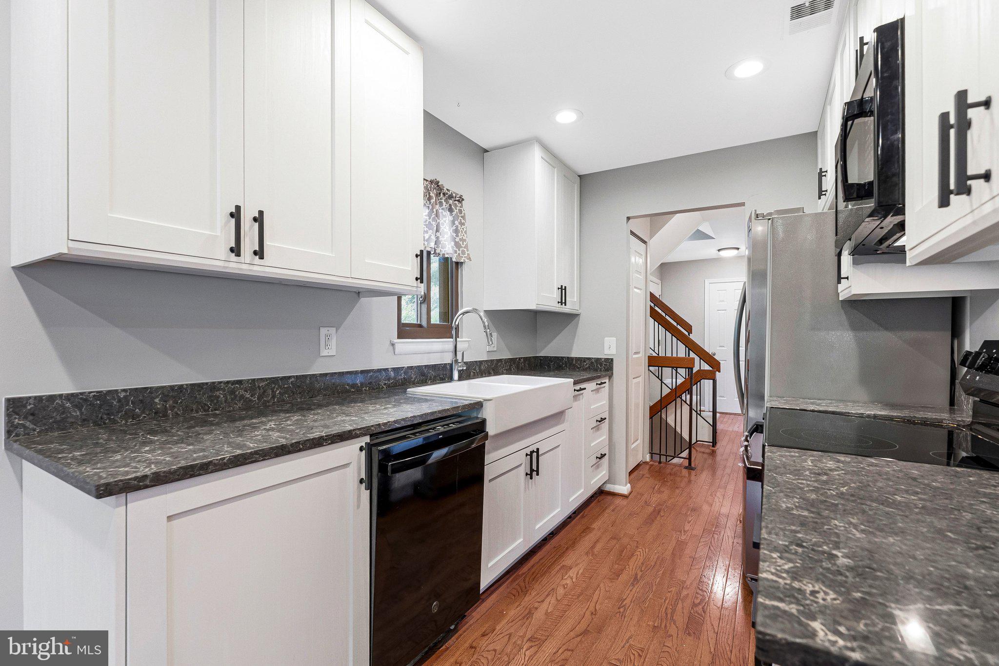2347 Millennium Lane Reston, VA 20191 - Photo 5 of 47 Modern kitchen with sleek finishes.
