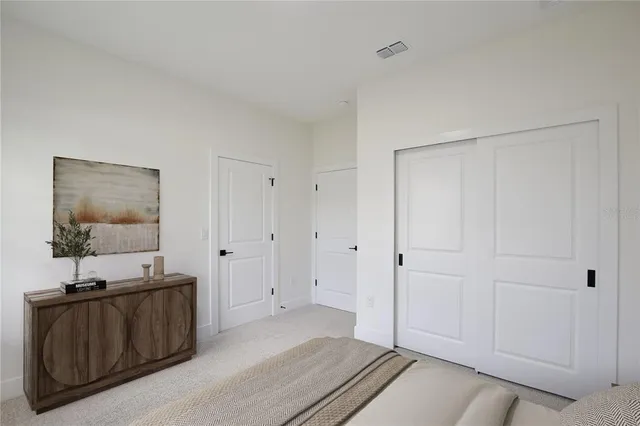 a view of a room with a sink and mirror