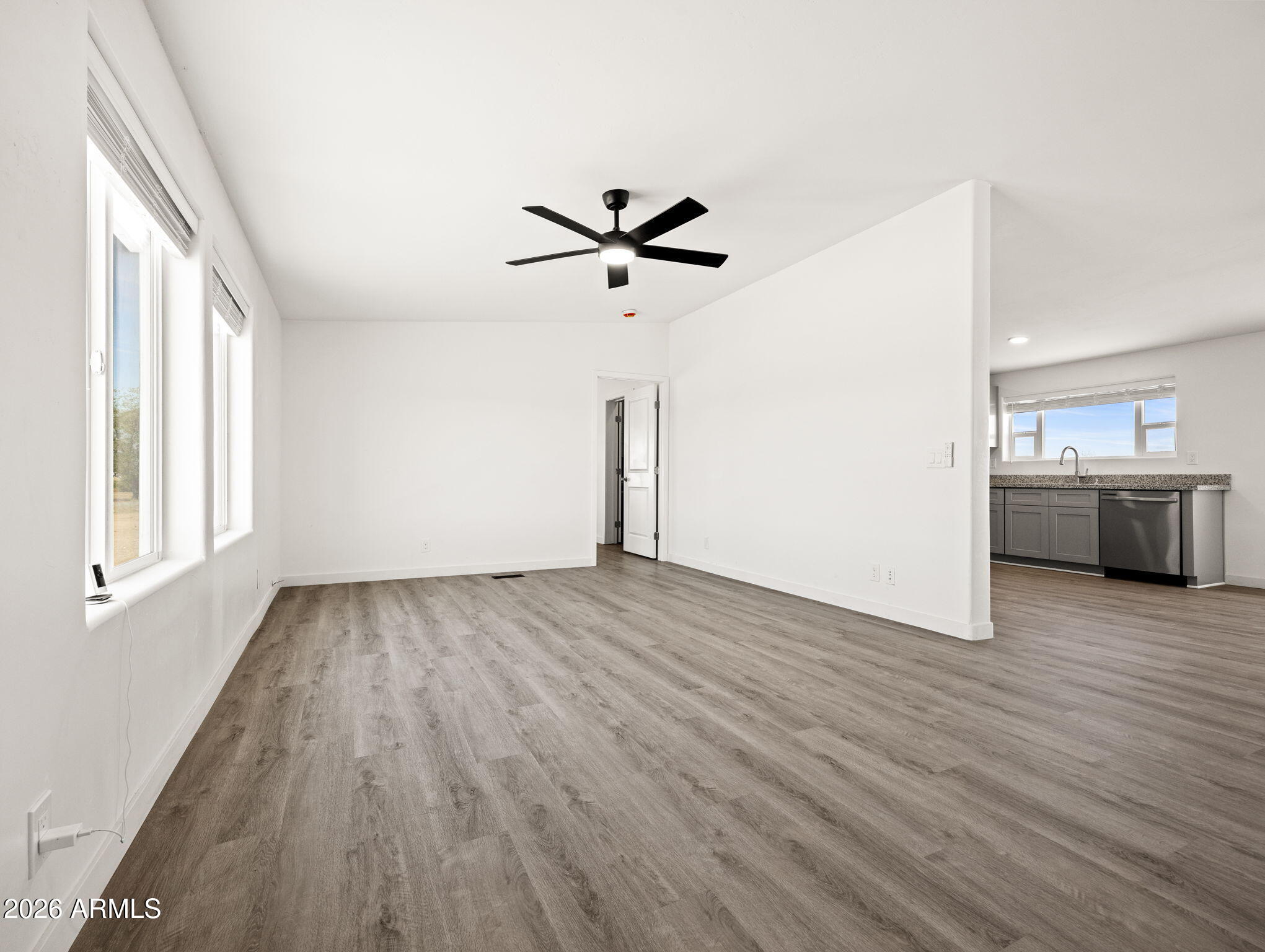 1754 West Deadwood Ranch Road Paulden, AZ 86334 - Photo 13 of 51 wooden floor in an empty room with a window