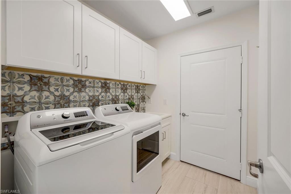 16348 Viansa Way, Unit 101 Naples, FL 34110 - Photo 18 of 34 Laundry Room with Utility Tub
