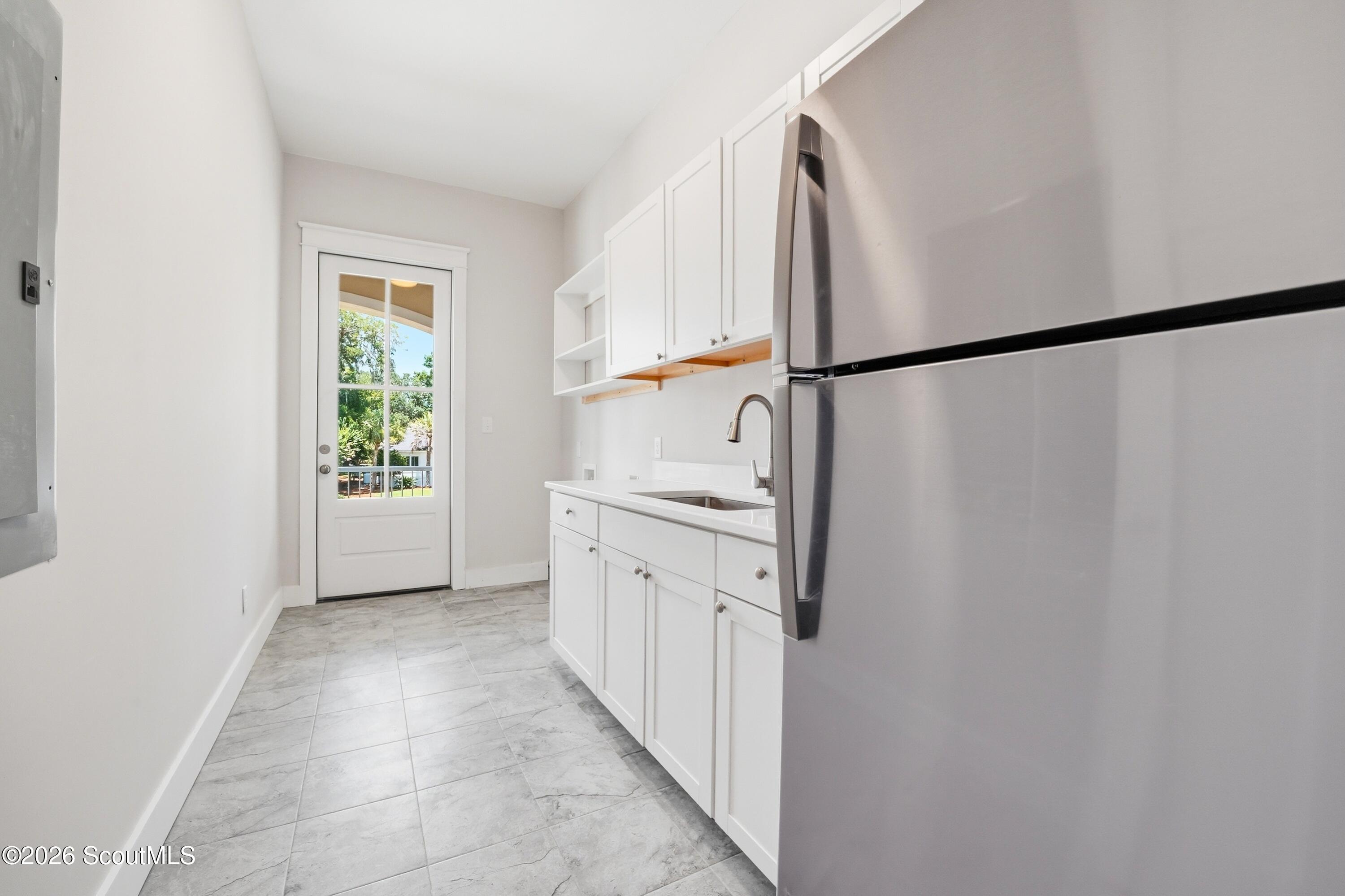 123 Rice Mill St. Simons Island, GA 31522 - Photo 45 of 83 Laundry Room with extra fridge