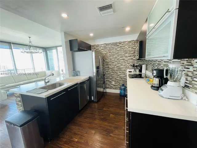 a kitchen with sink cabinets and window
