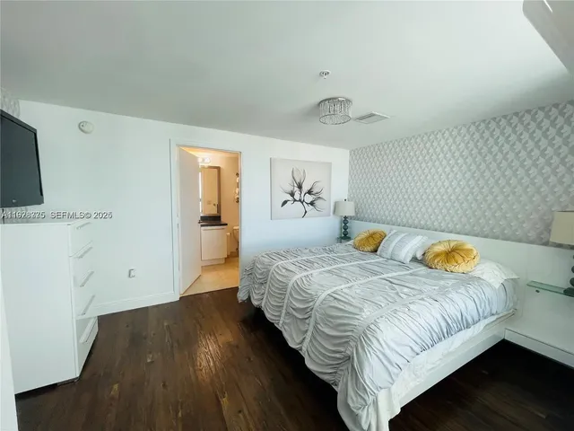a bedroom with bed and window