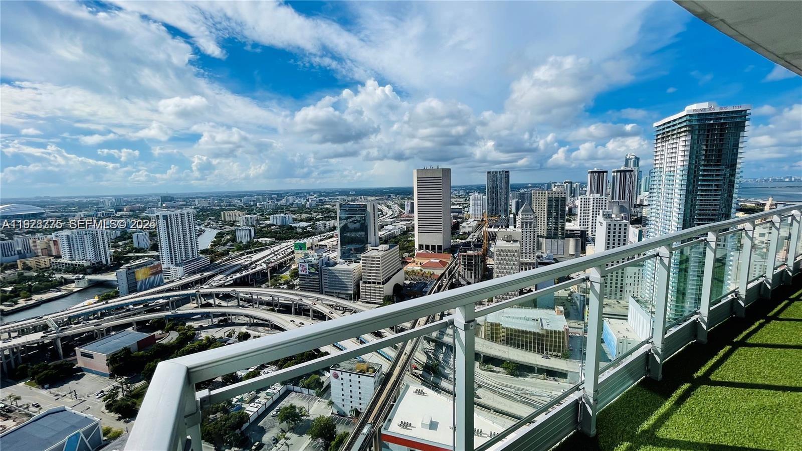 90 Southwest 3rd Street, Unit 4404 Miami, FL 33130 - Photo 24 of 28 a city view from a balcony