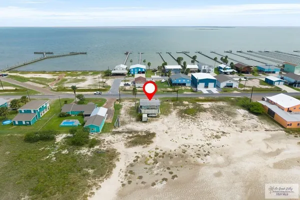 a view of swimming pool with a table and chairs