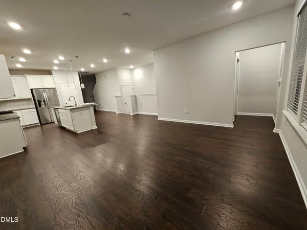a view of kitchen with furniture and wooden floor
